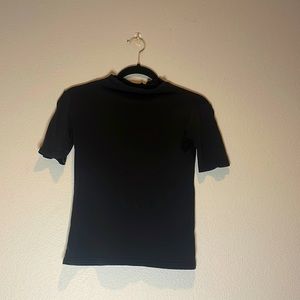 Plain black turtle neck.